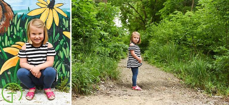 a child poses on a lush green path in ypsilanti's frog island