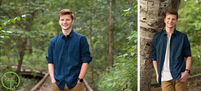 A high school senior poses on the Wetland Boardwalk for his portrait