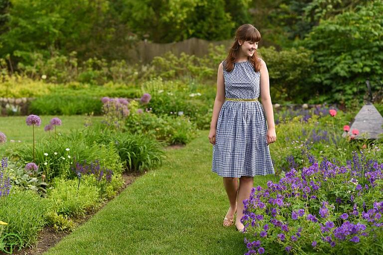 a teenage girl walks along a beautiful garden at matthaei botanical gardens