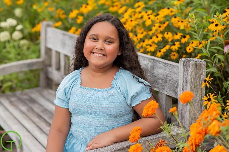 A young girl poses for a her Matthaei Botanical Gardens portrait session